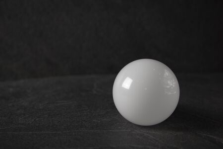 Light bulbs on black stone backgroundの写真素材