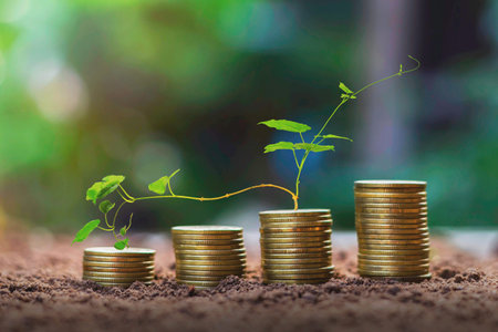 Stack coins with plant growth as steps The concept of business growth