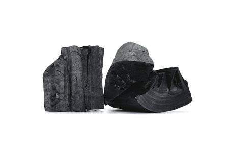 The black charcoal is used as heat energy. Isolated on white backgroundの写真素材