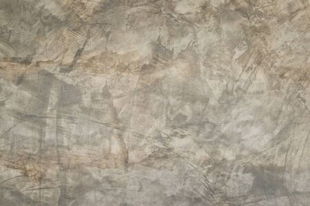 The cement wall shows the pattern of the building's wall and is painted with liquid solution.の写真素材
