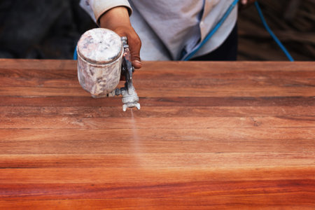 The painter is painting the wooden floorの写真素材