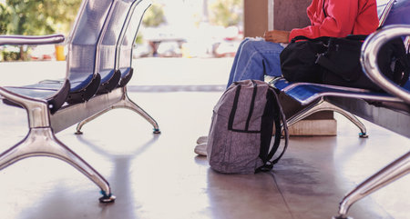 Tourists leave their belongings on the platform while waiting for the bus.の写真素材