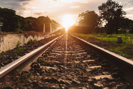 Rural train tracks with beautiful nature on both sides of the roadの写真素材