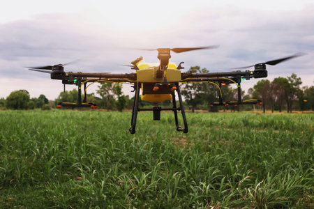 farmers are using Flying drone spraying medicine in agriculture