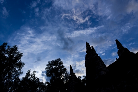 Silhouette of Ancient Pagoda with Blue and Cloudy Sky in Background.の写真素材