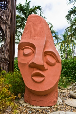 Orange Stone Head in the Garden.の写真素材