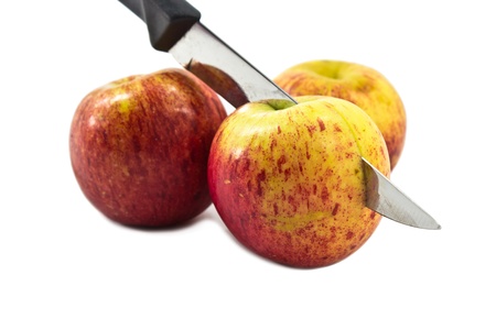 Photo of Stabbed Apples on White Background の写真素材
