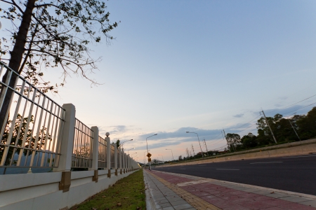 Long and Distant Road with Twilight Sky Background の写真素材