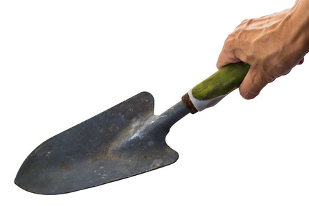 Old garden hand trowel in working handの写真素材