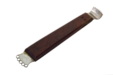 Thai kitchen tool to make shredded coconut, on white background の写真素材