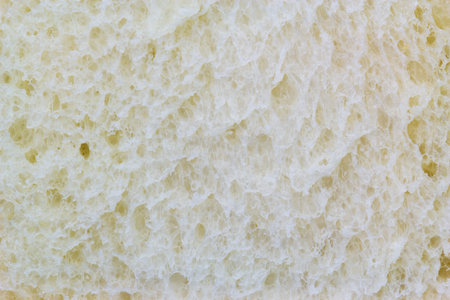 Food background, sliced white bread closeup texture