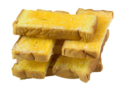 Crispy sliced bread with butter and sugar, isolated on white background and clipping pathの写真素材