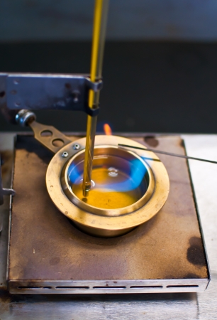 Blue flame in a flash point testerの写真素材