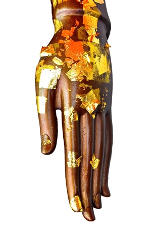 Buddha hand with gold leaf on white backgroundの写真素材
