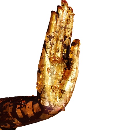 Buddha hand with gold leaf on white backgroundの写真素材