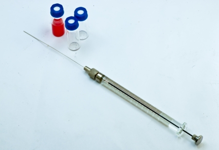 Micro syrine and sample vials on white backgroundの写真素材