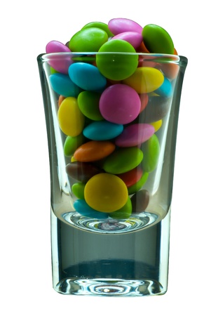 Colorful candy in a shot glassの写真素材