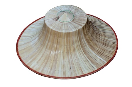 a hat made of bamboo and palm leaves shaped like an inverted basin isolatedの写真素材