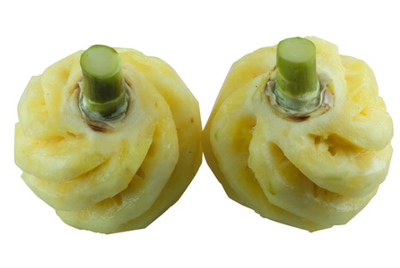 Two small pineapples in front of white backgroundの写真素材