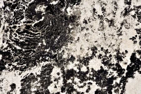 Decayed tarmac on lime stone floorの写真素材