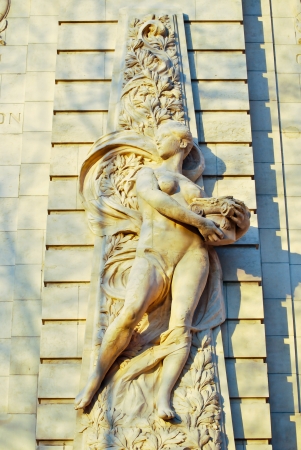A high relief image of women carring a potのeditorial素材