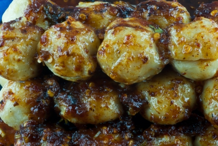 Stack of meatball with spicy sauceの写真素材