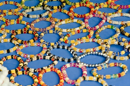 Rows of colorful hand-made bracelets - shallow DOF の写真素材