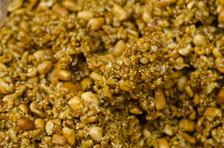 Thai sweet made of rice, nut, sesame-seeds and sugar.