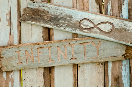 The wooden sign with word infinityの写真素材