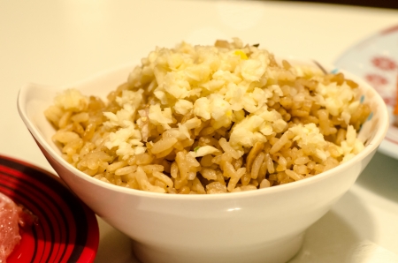 close up of a bowl of garlic fried riceの写真素材