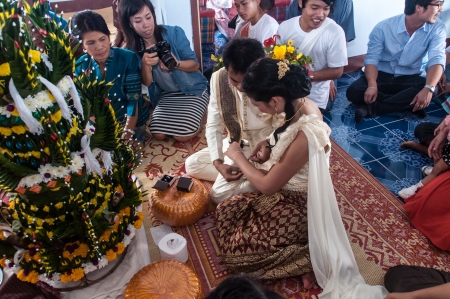 Asian thai couple bride and bridegroom in thai wedding suit at wedding ceremonyのeditorial素材