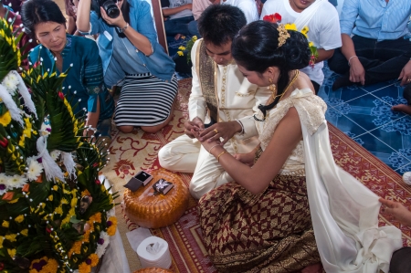 Asian thai couple bride and bridegroom in thai wedding suit at wedding ceremonyのeditorial素材