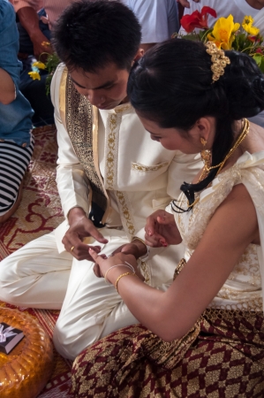 Asian thai couple bride and bridegroom in thai wedding suit at wedding ceremonyのeditorial素材