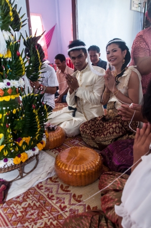 Asian thai couple bride and bridegroom in thai wedding suit at wedding ceremonyのeditorial素材