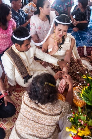 Asian thai couple bride and bridegroom in thai wedding suit at wedding ceremonyのeditorial素材