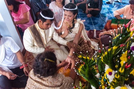 Asian thai couple bride and bridegroom in thai wedding suit at wedding ceremonyのeditorial素材