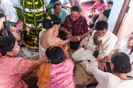 Asian thai couple bride and bridegroom in thai wedding suit at wedding ceremonyのeditorial素材