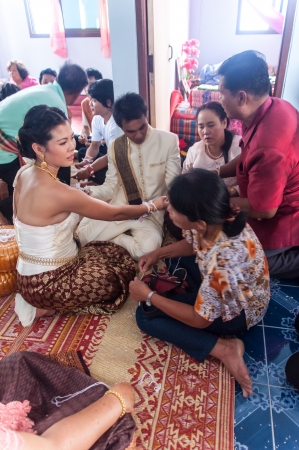 Asian thai couple bride and bridegroom in thai wedding suit at wedding ceremonyのeditorial素材