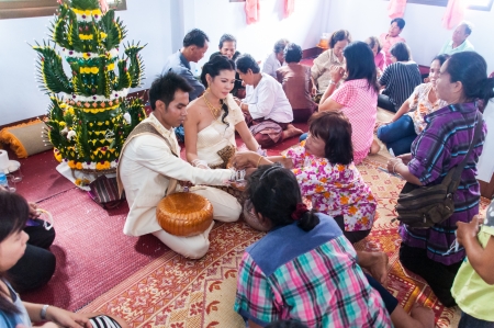 Asian thai couple bride and bridegroom in thai wedding suit at wedding ceremonyのeditorial素材