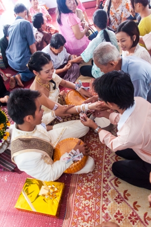 Asian thai couple bride and bridegroom in thai wedding suit at wedding ceremonyのeditorial素材