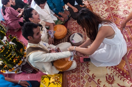 Asian thai couple bride and bridegroom in thai wedding suit at wedding ceremonyのeditorial素材