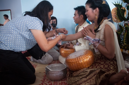 Asian thai couple bride and bridegroom in thai wedding suit at wedding ceremonyのeditorial素材