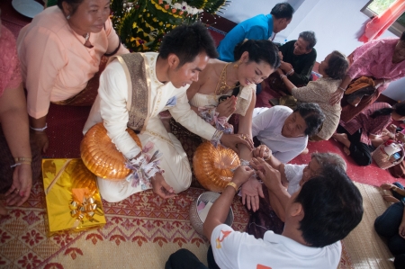Asian thai couple bride and bridegroom in thai wedding suit at wedding ceremonyのeditorial素材