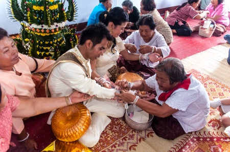 Asian thai couple bride and bridegroom in thai wedding suit at wedding ceremonyのeditorial素材