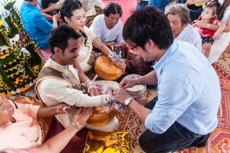 Asian thai couple bride and bridegroom in thai wedding suit at wedding ceremonyのeditorial素材
