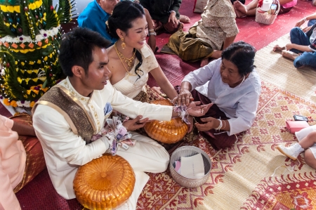 Asian thai couple bride and bridegroom in thai wedding suit at wedding ceremonyのeditorial素材