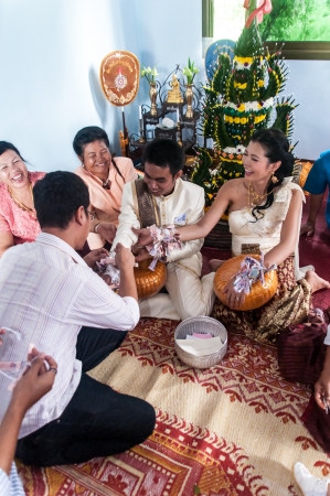 Asian thai couple bride and bridegroom in thai wedding suit at wedding ceremonyのeditorial素材