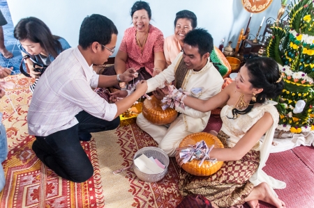 Asian thai couple bride and bridegroom in thai wedding suit at wedding ceremonyのeditorial素材