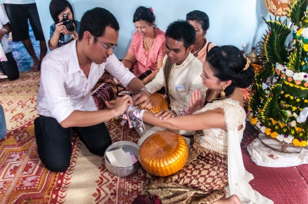 Asian thai couple bride and bridegroom in thai wedding suit at wedding ceremonyのeditorial素材