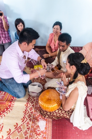 Asian thai couple bride and bridegroom in thai wedding suit at wedding ceremonyのeditorial素材